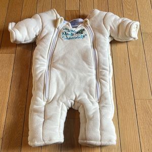 Baby Merlin’s magic sleep suit size small cream colored